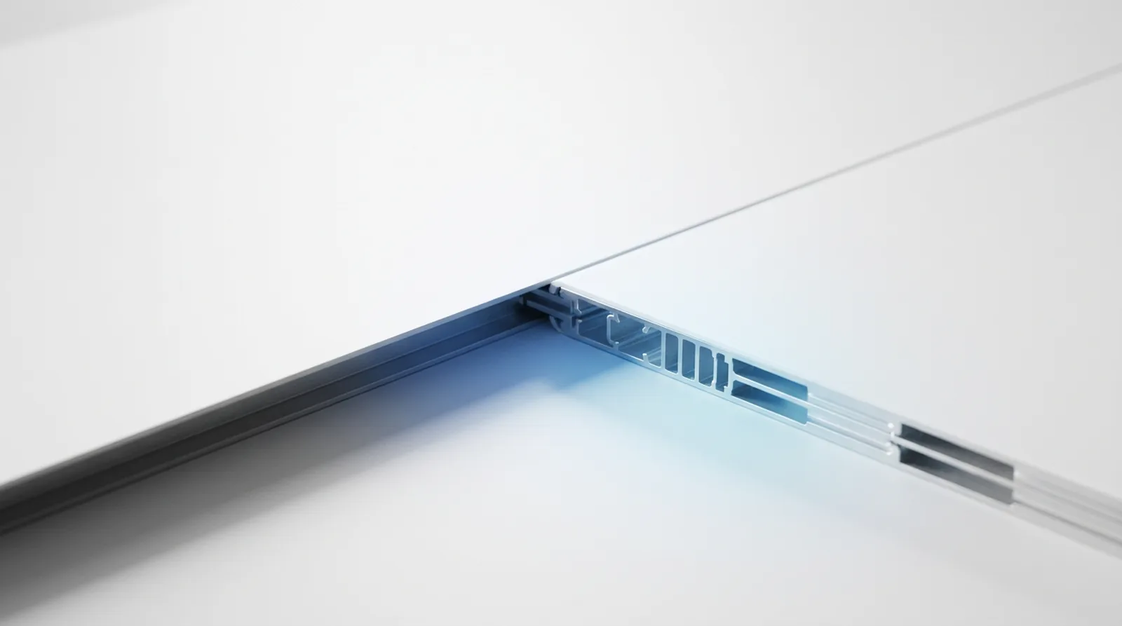 A plain matte surface lifting at one edge to reveal the precise ribbed substructure carrying it.
